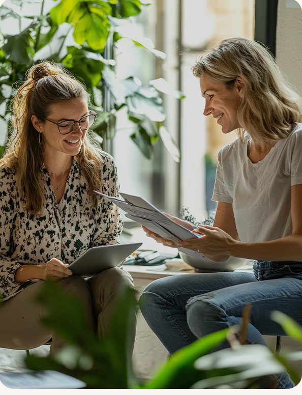 Two colleagues reviewing work together